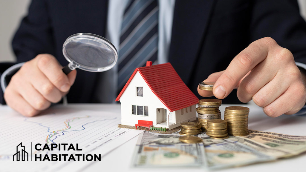 homme regardant des statistiques avec une maison modèle